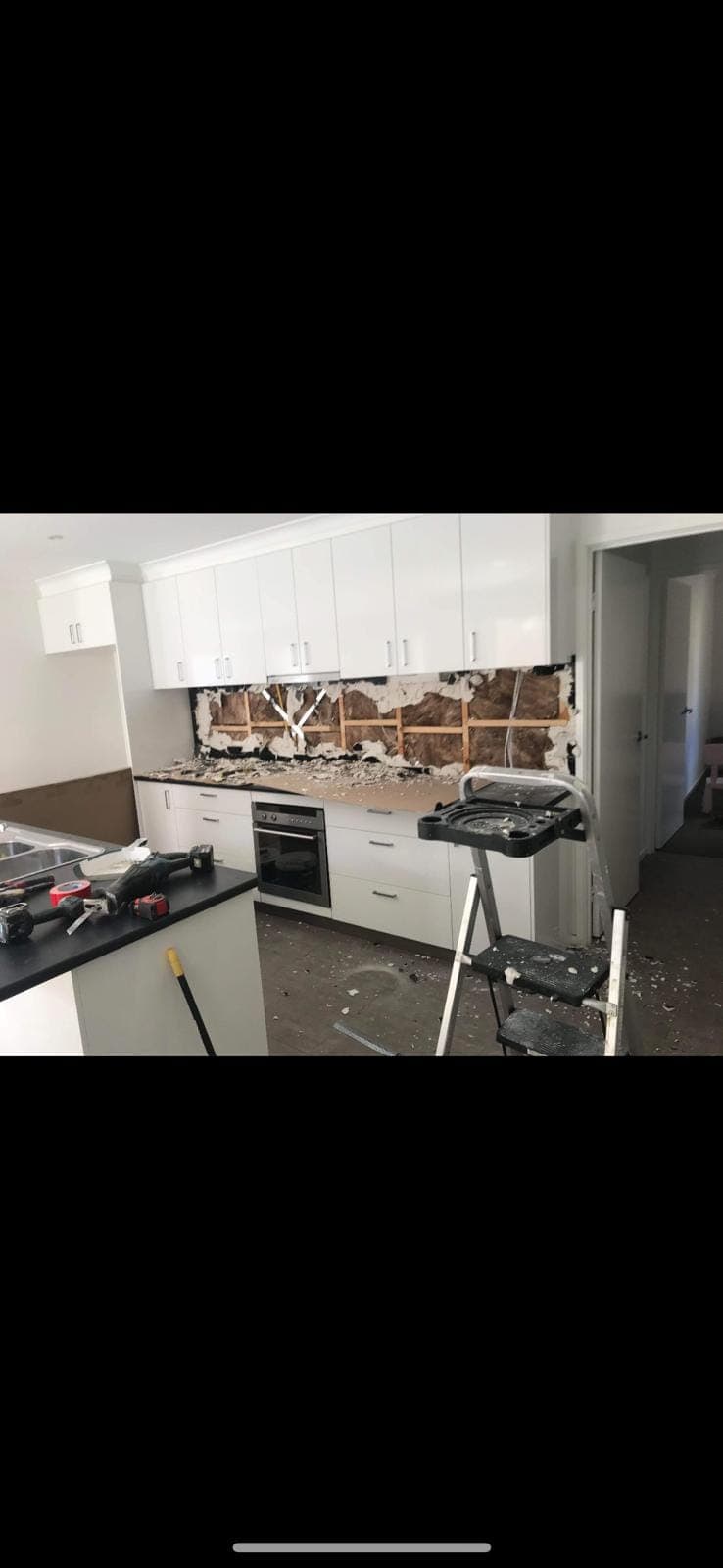 Renovation photo: kitchen demolition with backsplash removed