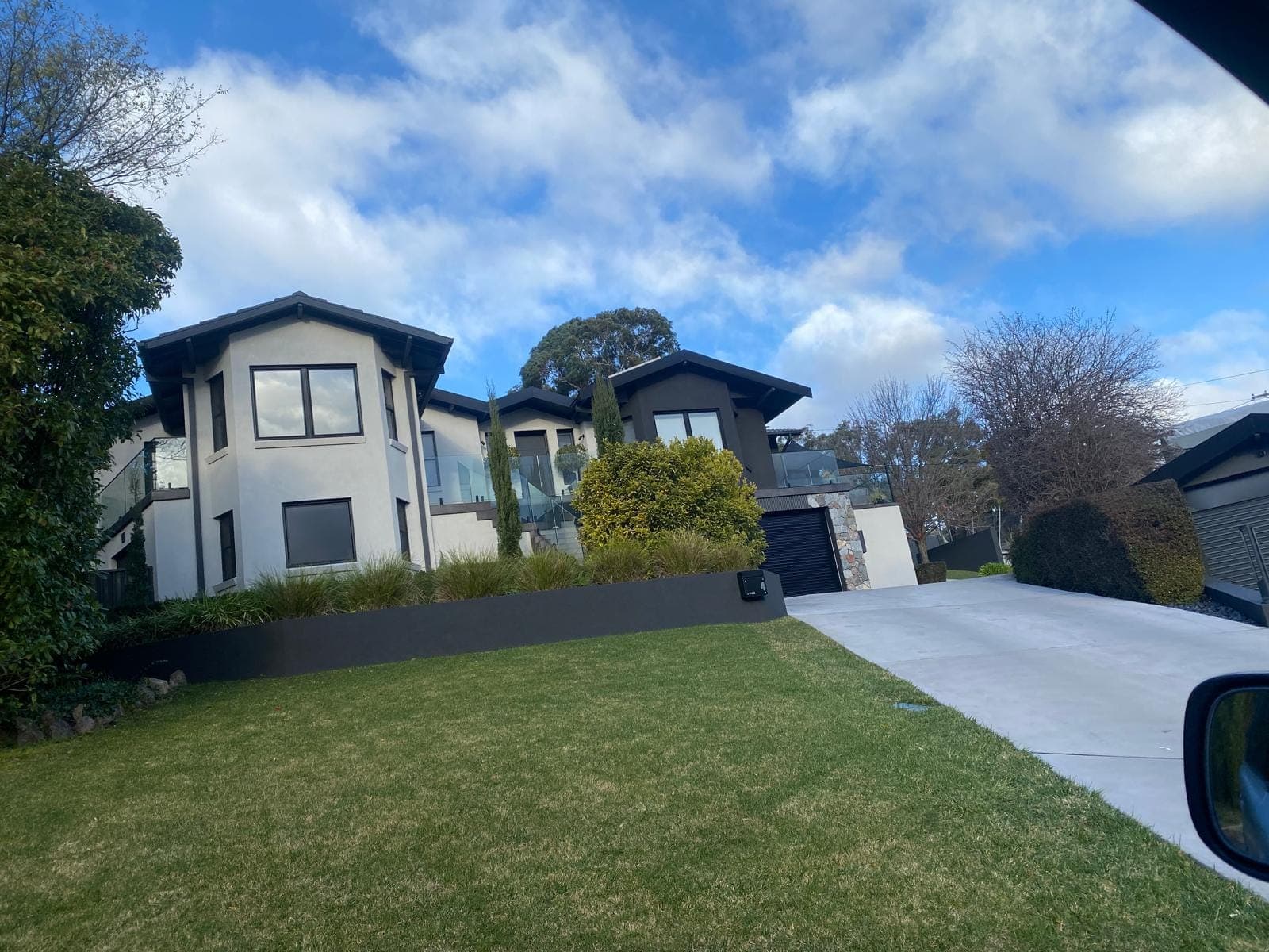 Renovation photo: two storey house exterior with green lawn